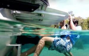 Boy Climbing Dive Platform Near Ecojet